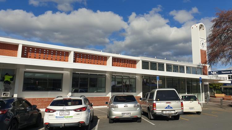 Exterior shot of cars next to the Naenae Community Centre.